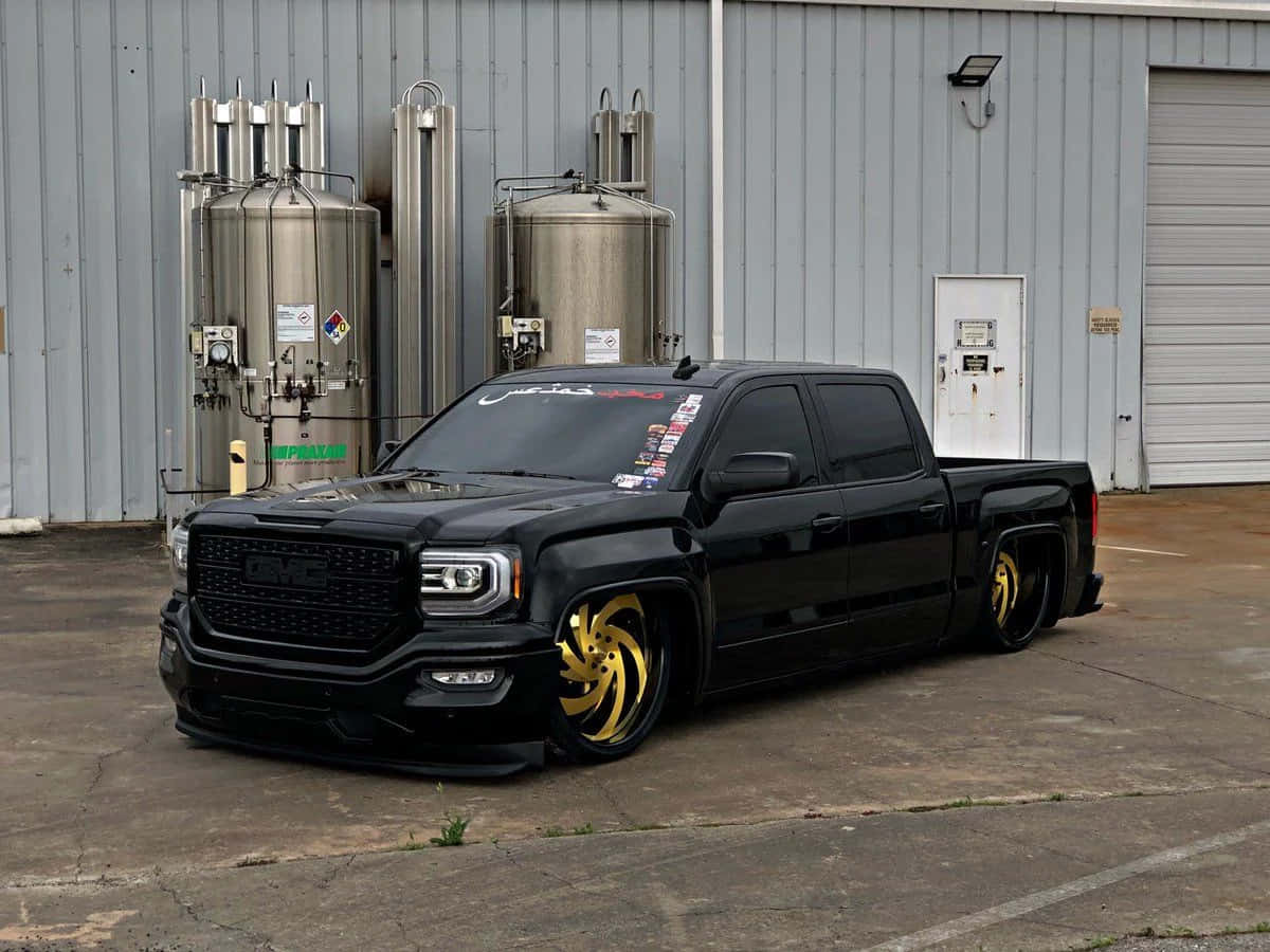 Customized Black Truck With Gold Wheels Wallpaper