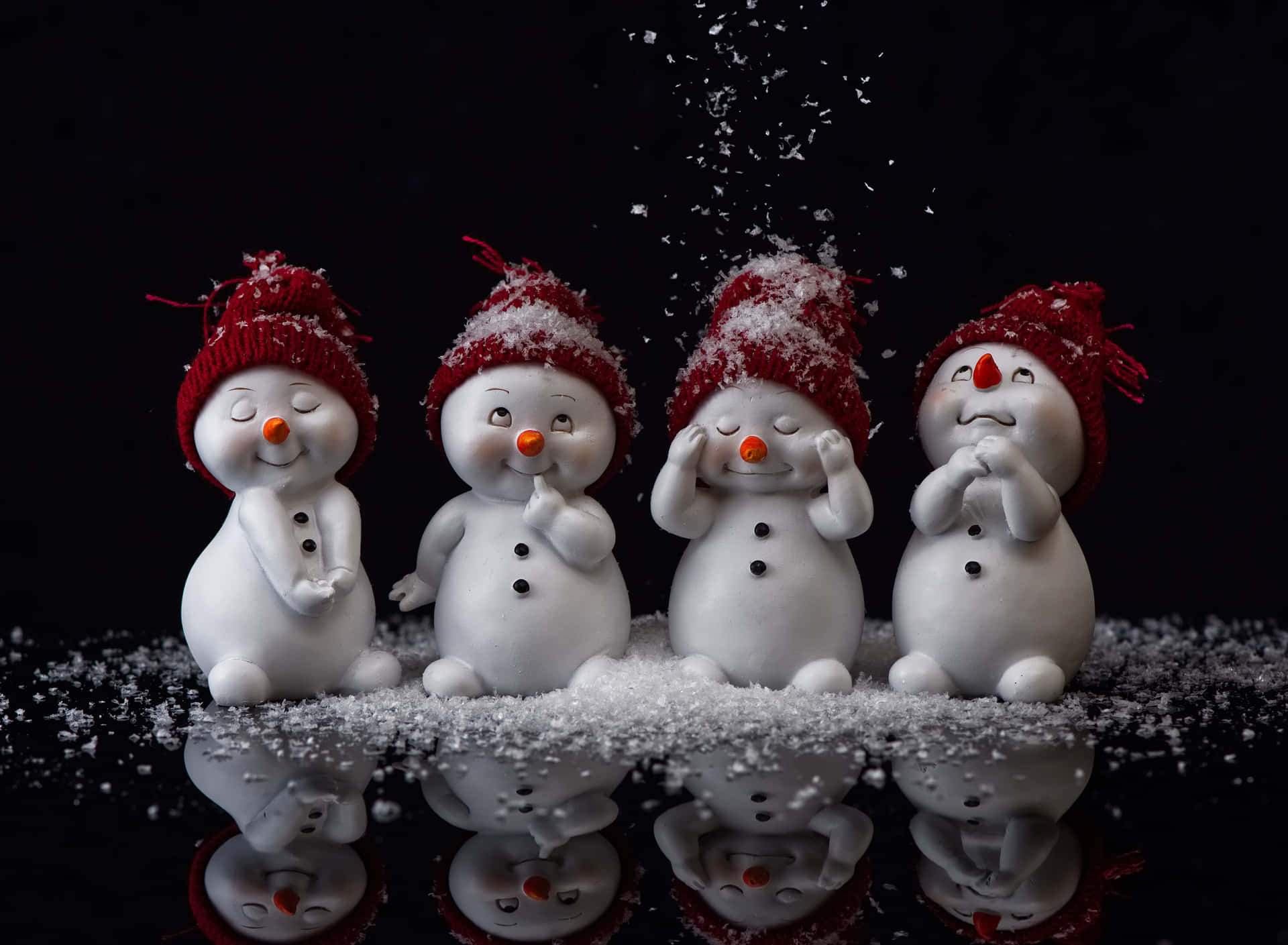 Snowmen In Red Hats On A Black Background