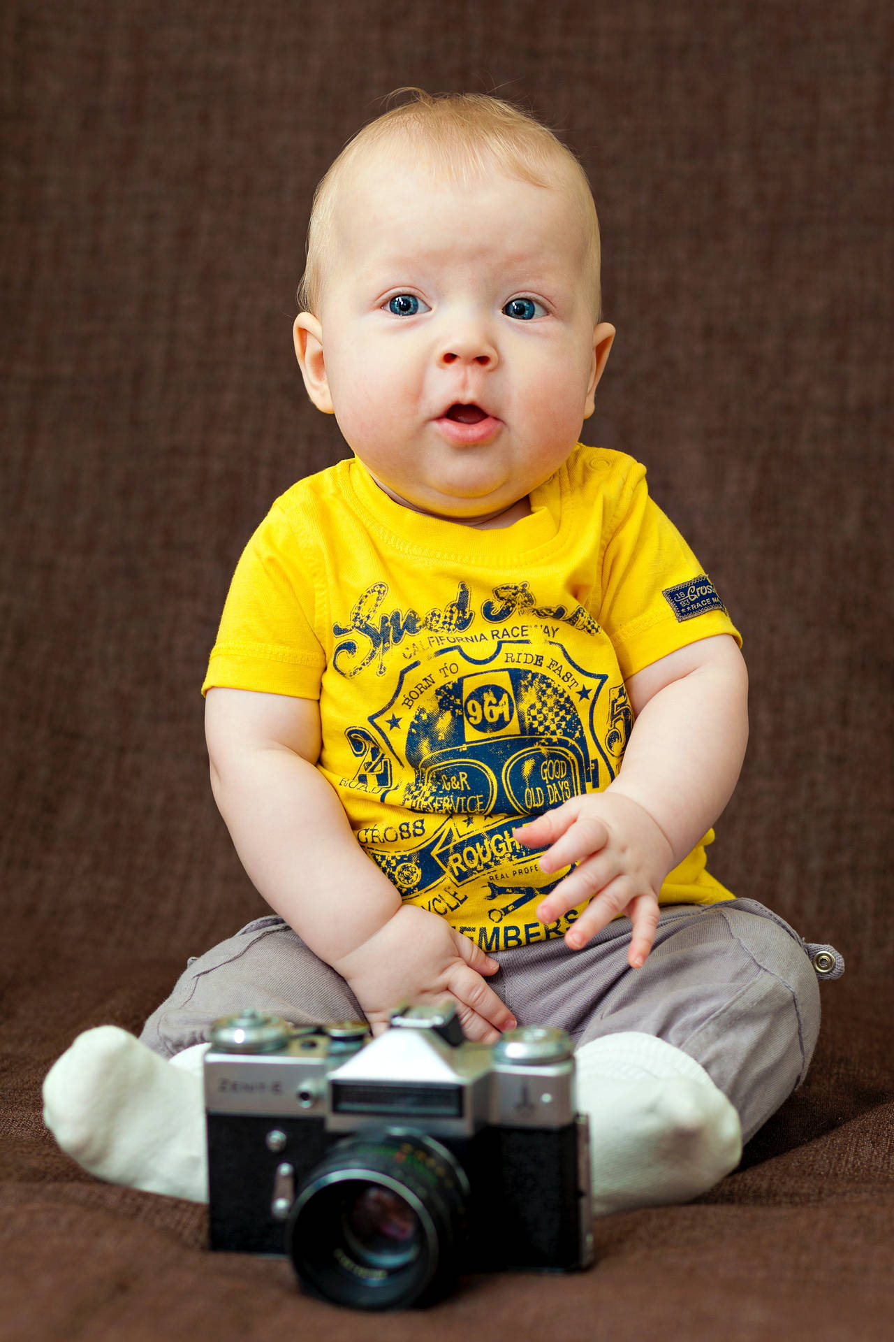 Cute Baby Boy With A Film Camera Wallpaper