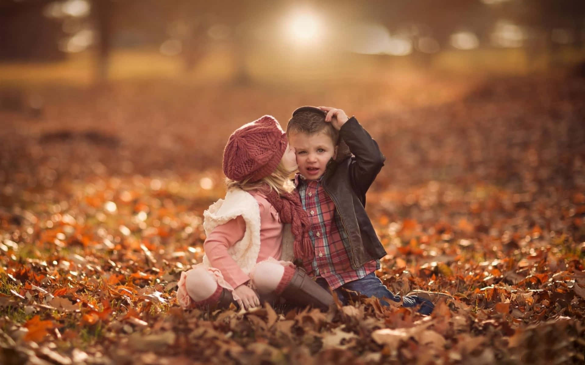 Cute Baby Couple Autumn Kiss Date Wallpaper
