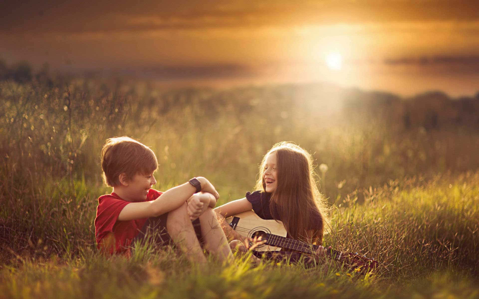 Cute Baby Couple Playing Guitar Sunset Wallpaper
