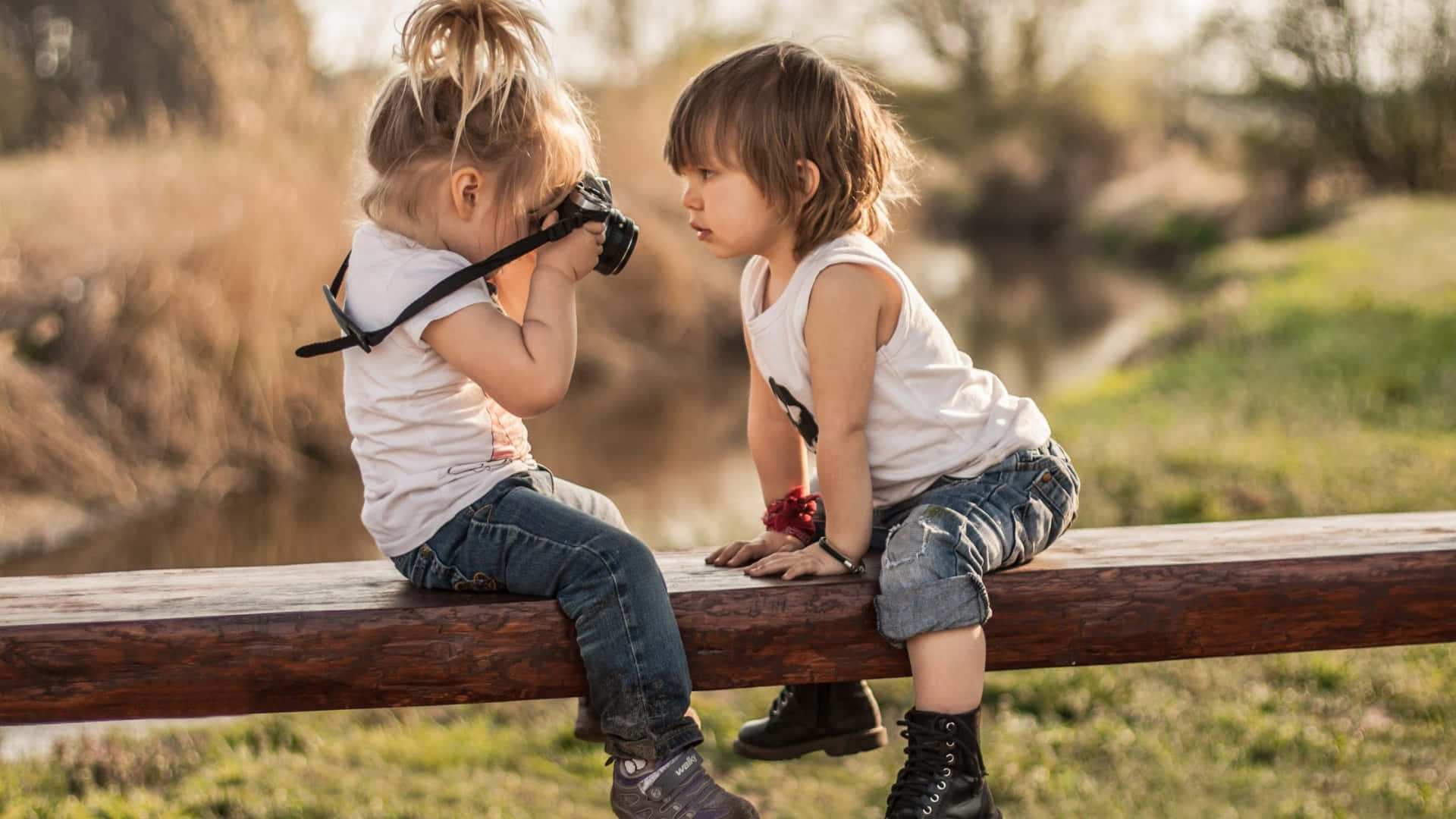 Cute Baby Couple Taking Pictures Wallpaper