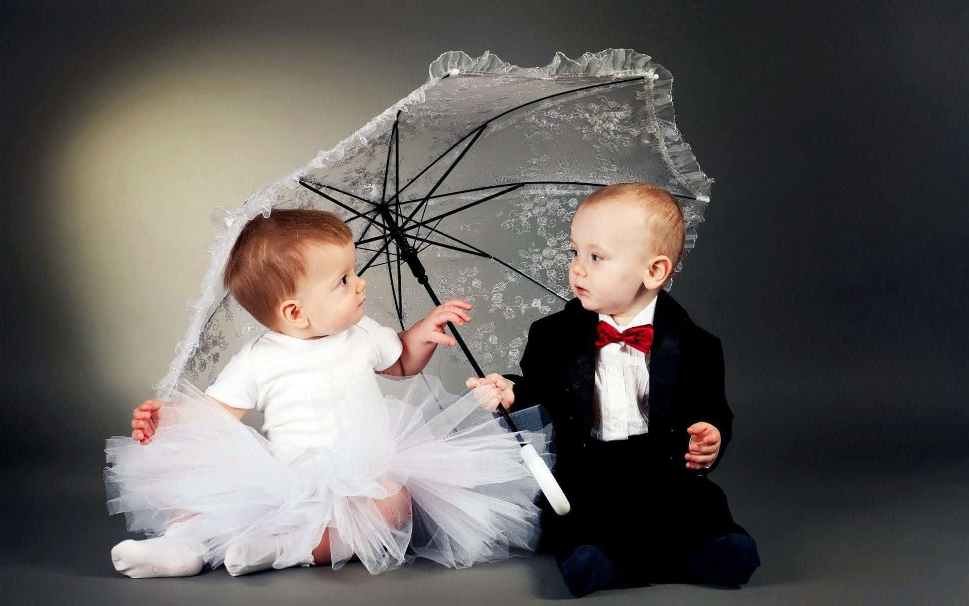 Cute Baby Couple With Umbrella Wallpaper