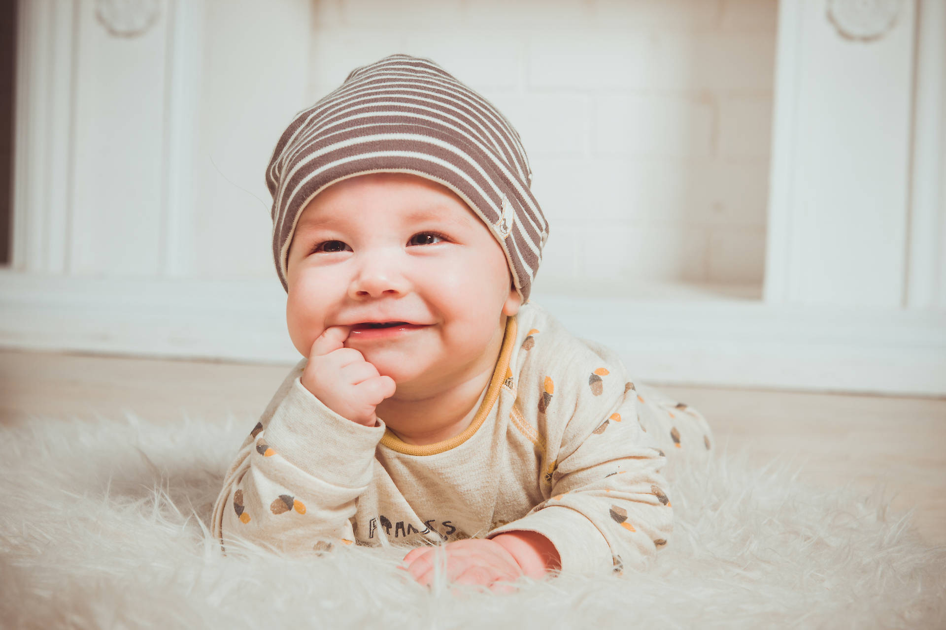Cute Baby In Pajamas And Bonnet Wallpaper