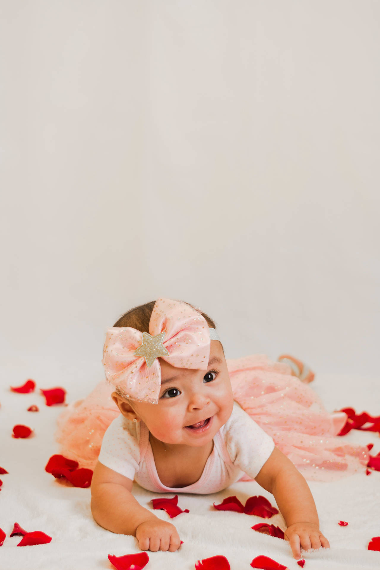Cute Baby In Pink Dress And Bow Wallpaper