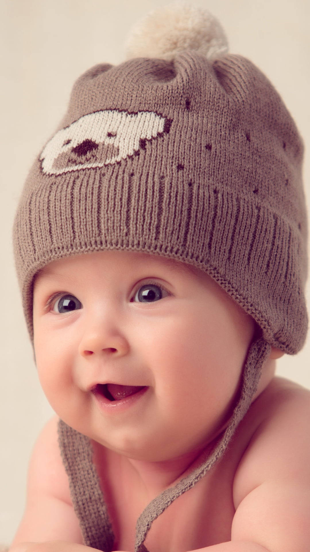 Cute Baby With A Bonnet Wallpaper