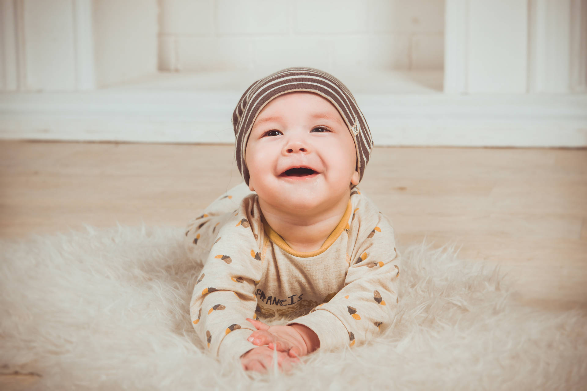 Cute Baby With A Wide Smile Wallpaper