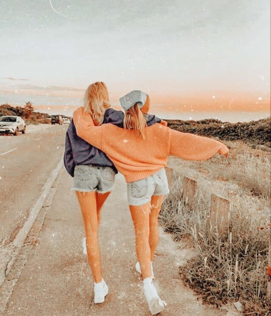 Download Cute Bff Walking In Road Side Picture | Wallpapers.com