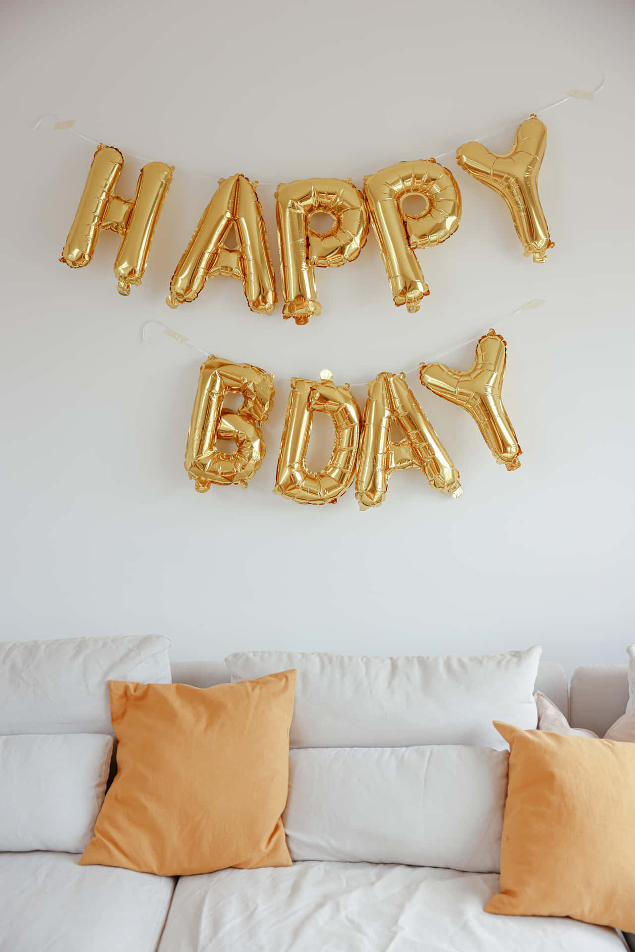A Gold Balloon With Happy Birthday Written On It Wallpaper