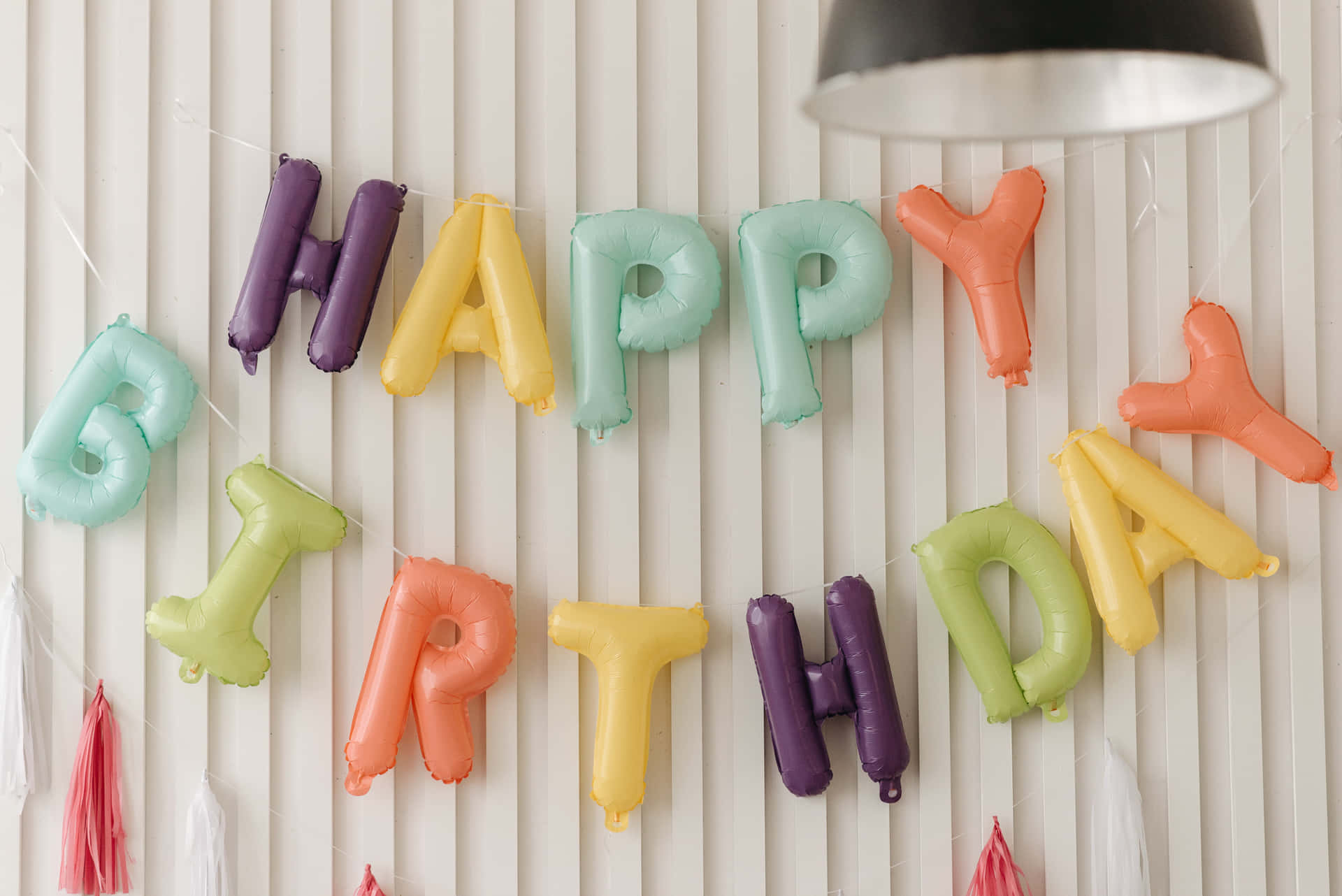 Happy Birthday Balloons Hanging On A Wall Wallpaper