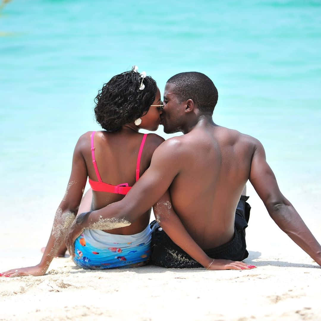 Cute Black Couple Kissing On Beach Picture