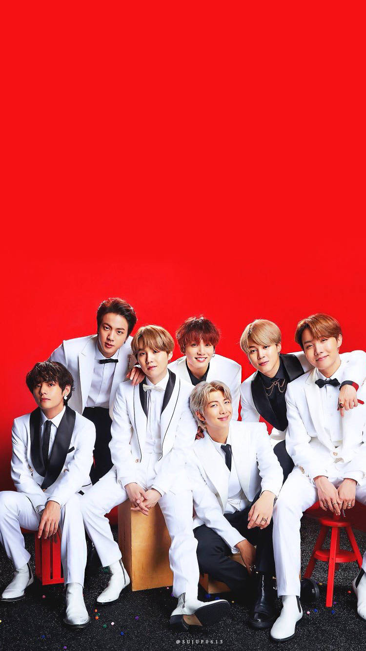 Cute Bts Group In Red Backdrop Wallpaper