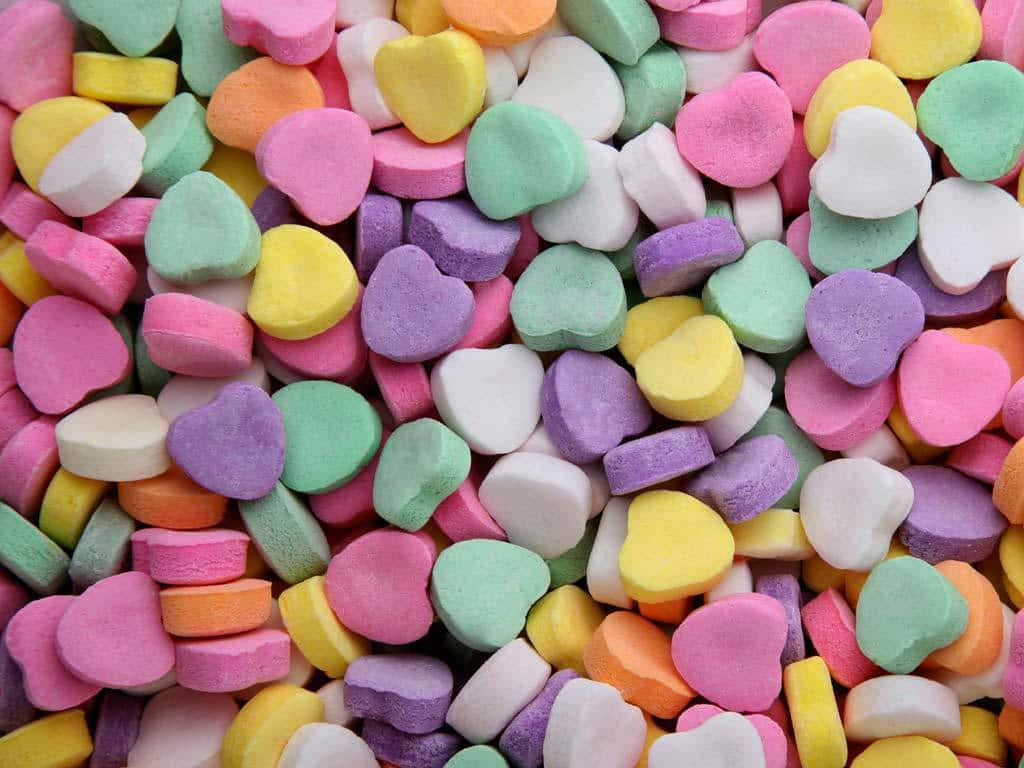 Cute Candies Heart Shapes Piled Together Wallpaper
