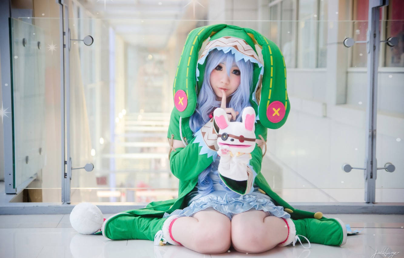 Cute Cosplayerwith Plushie Dragon Hoodie Wallpaper