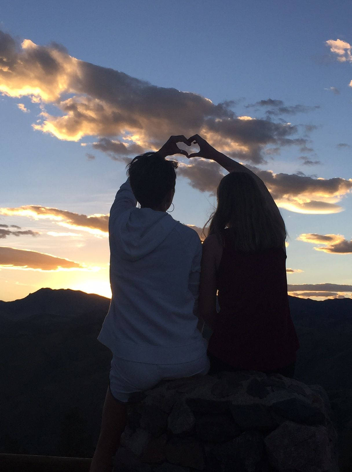 Cute Couple Making Heart At Sunset