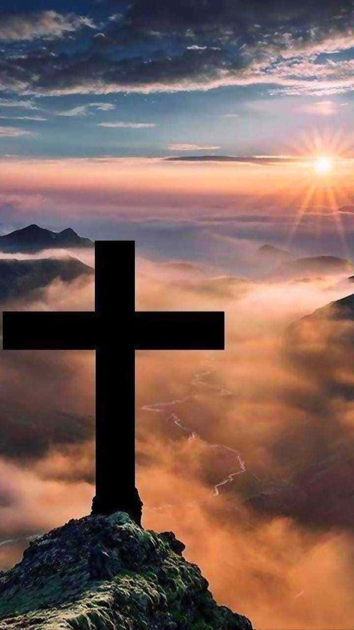 Cute Cross On Mountain Top In The Clouds Wallpaper