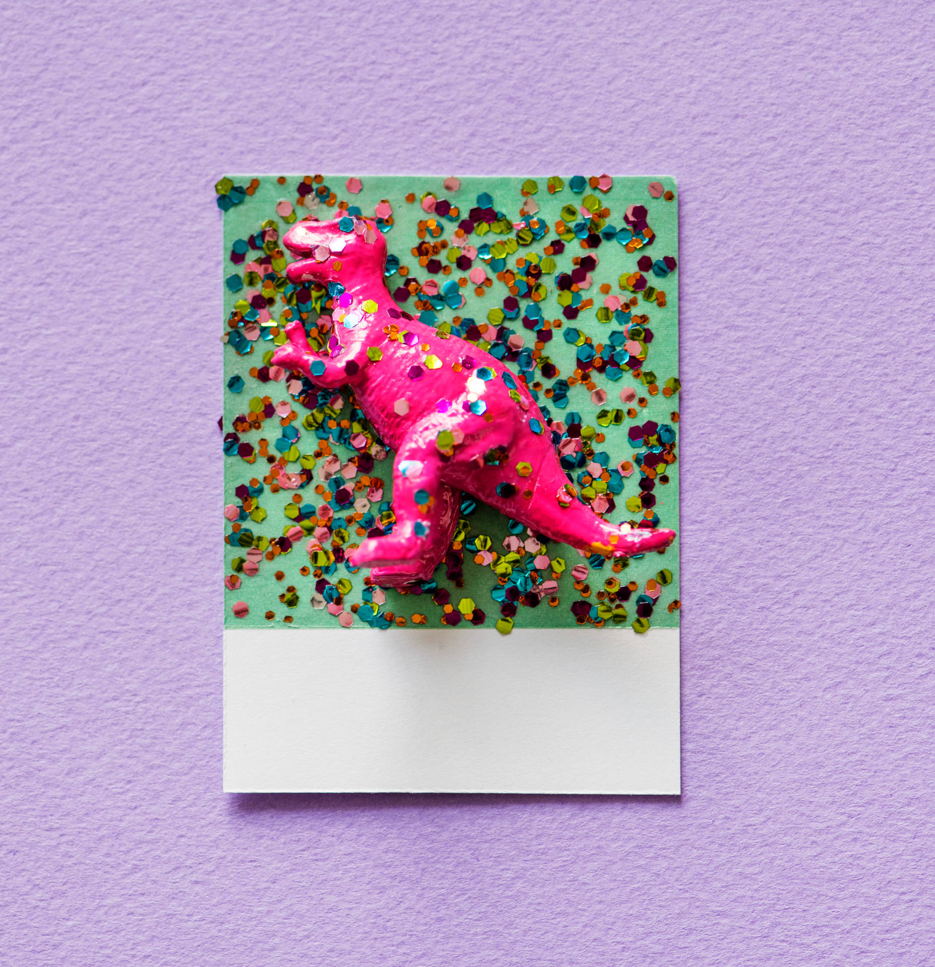Cute Dinosaur Toy With Confetti Wallpaper