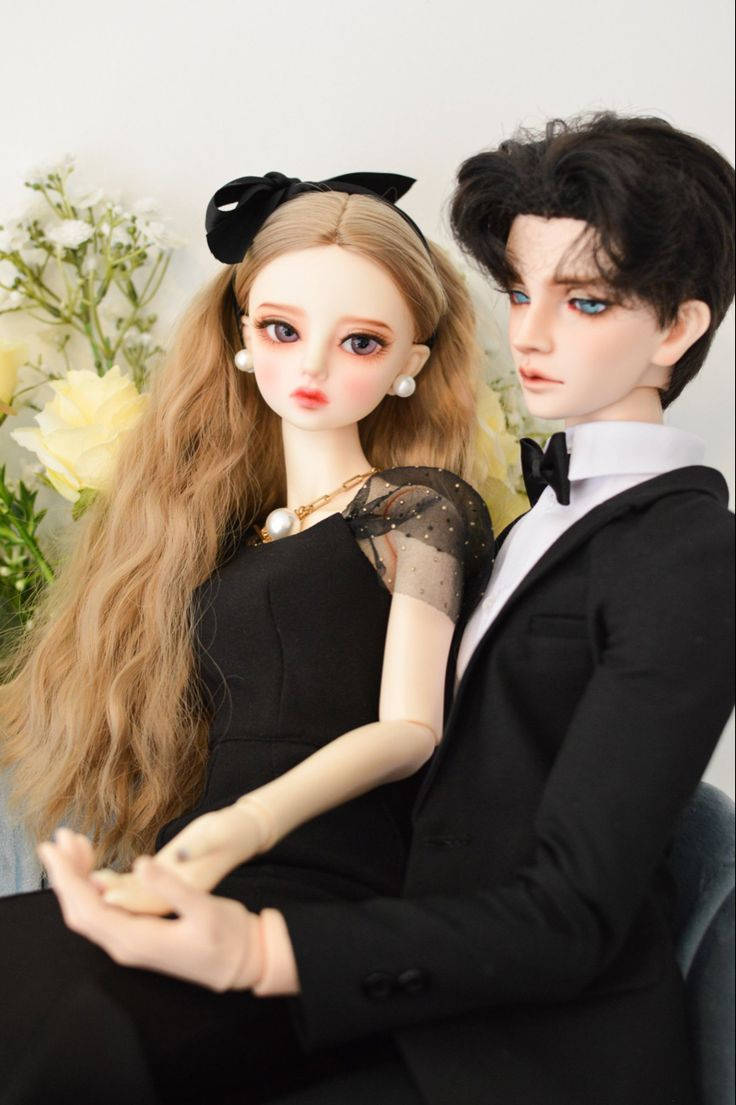 Download Cute Doll Couple In Black Outfits Wallpaper 