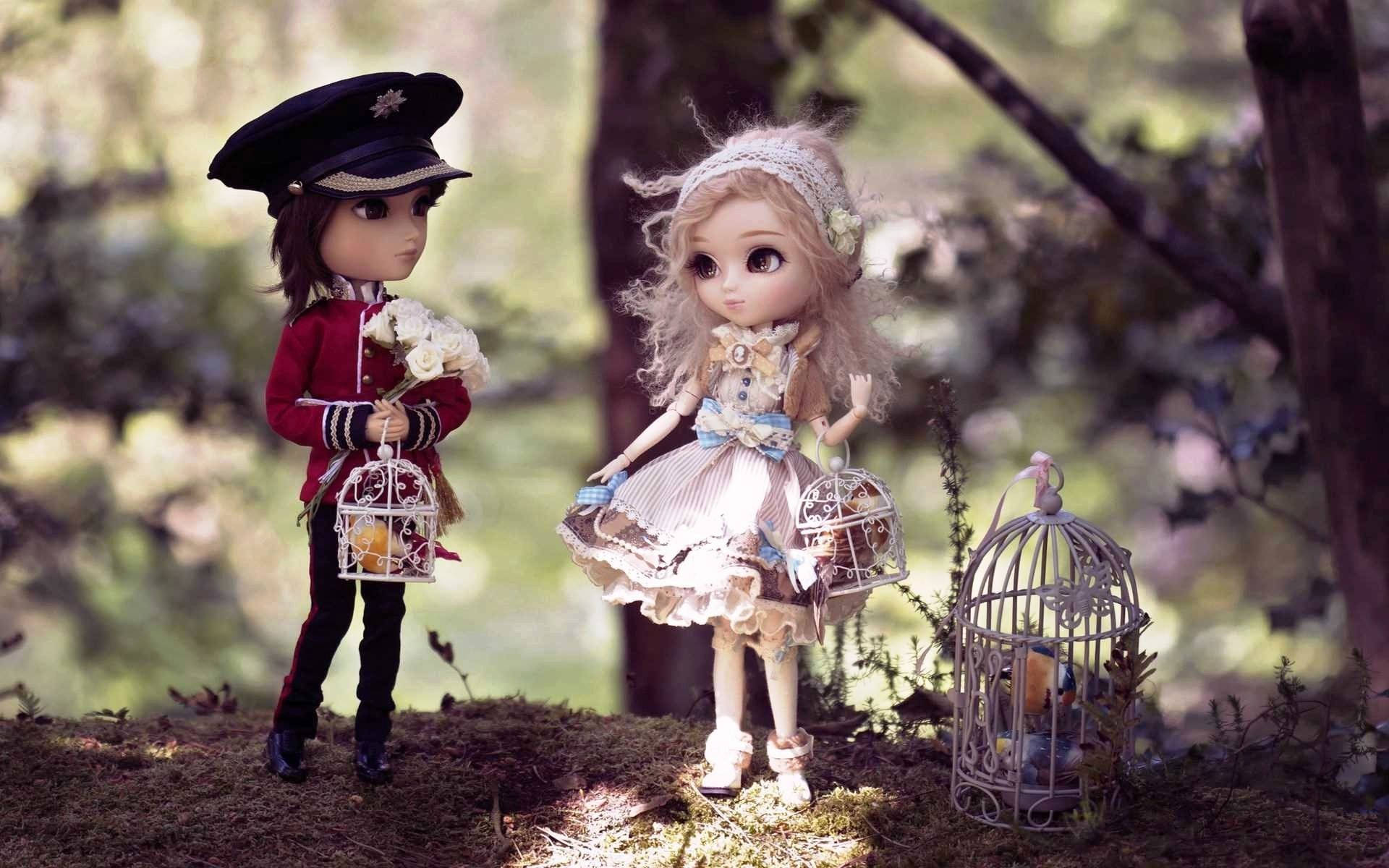 Cute Doll Couple With Birdcages Wallpaper