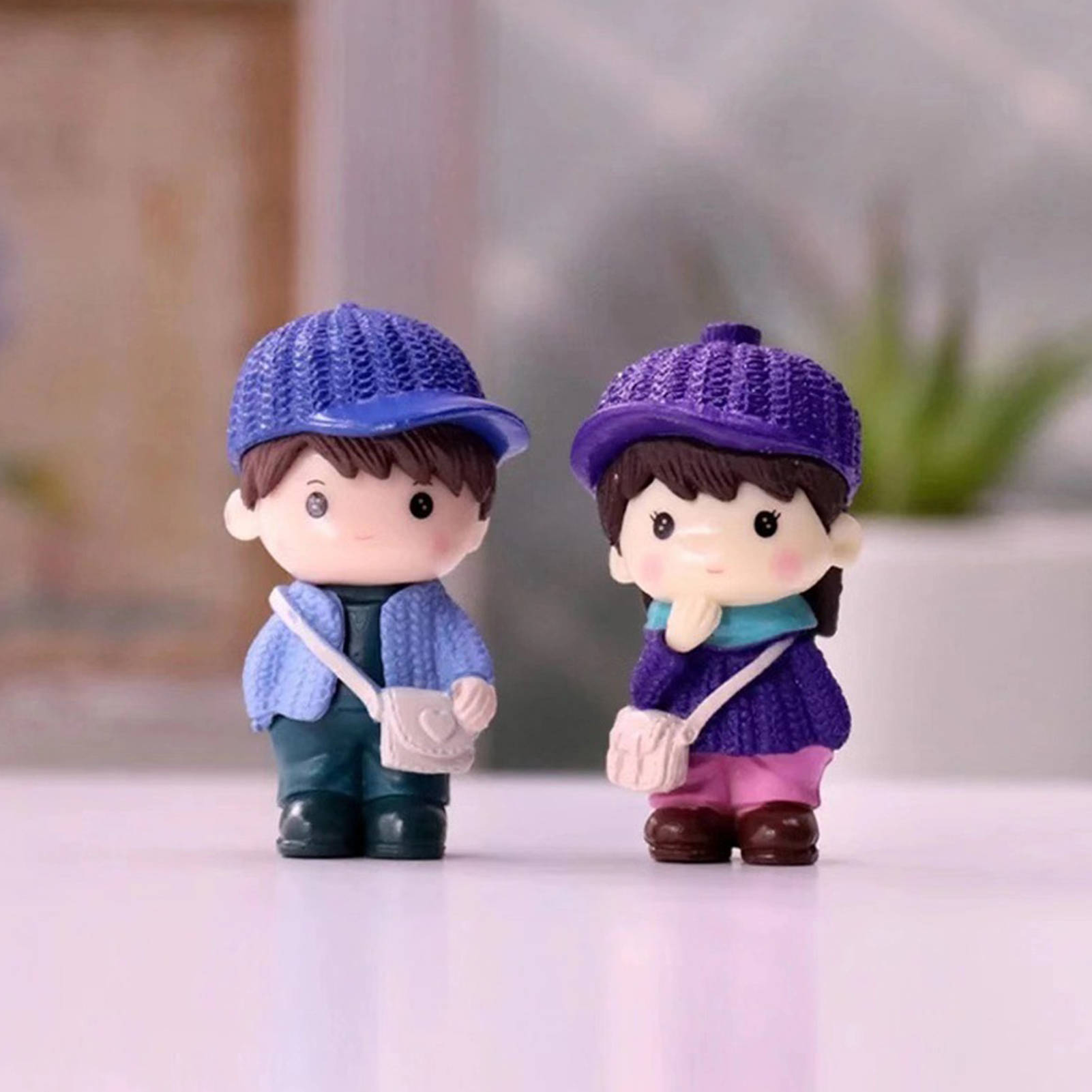 Download Cute Doll Couple With Purple Hats Wallpaper 