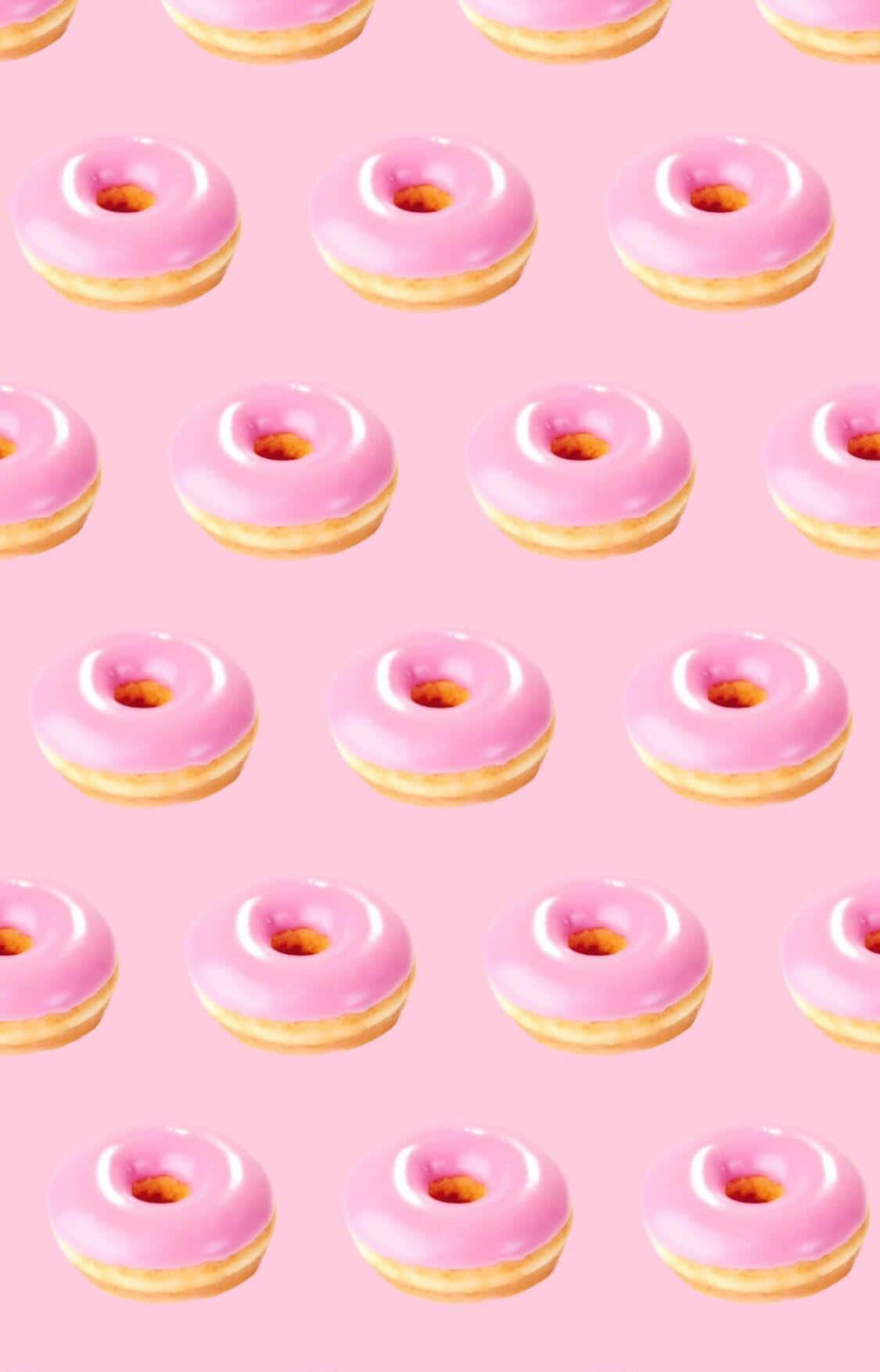 Adorable Donut With Sprinkles and Pink Icing Wallpaper