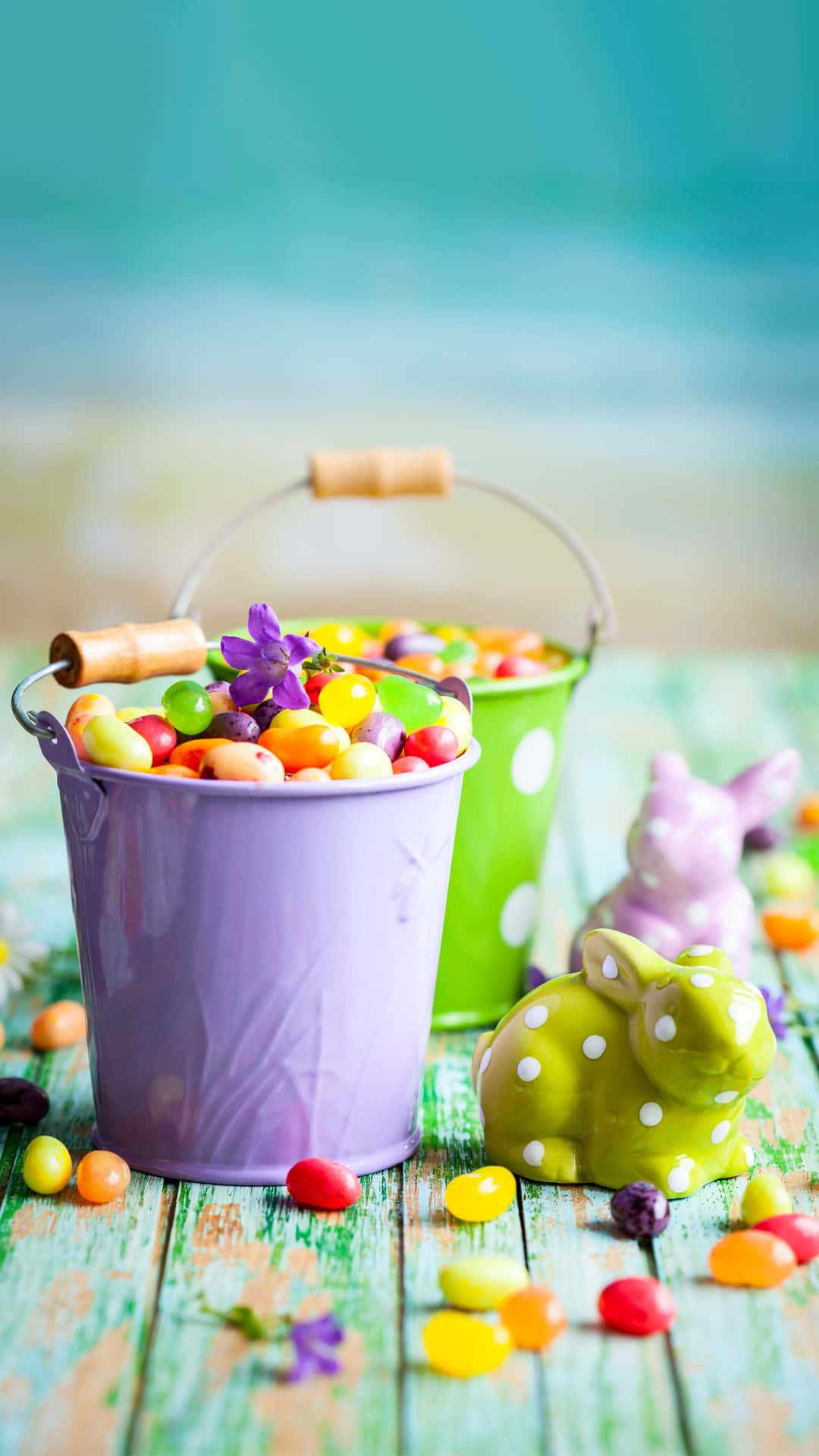 Easter Baskets With Candy On A Wooden Table Wallpaper