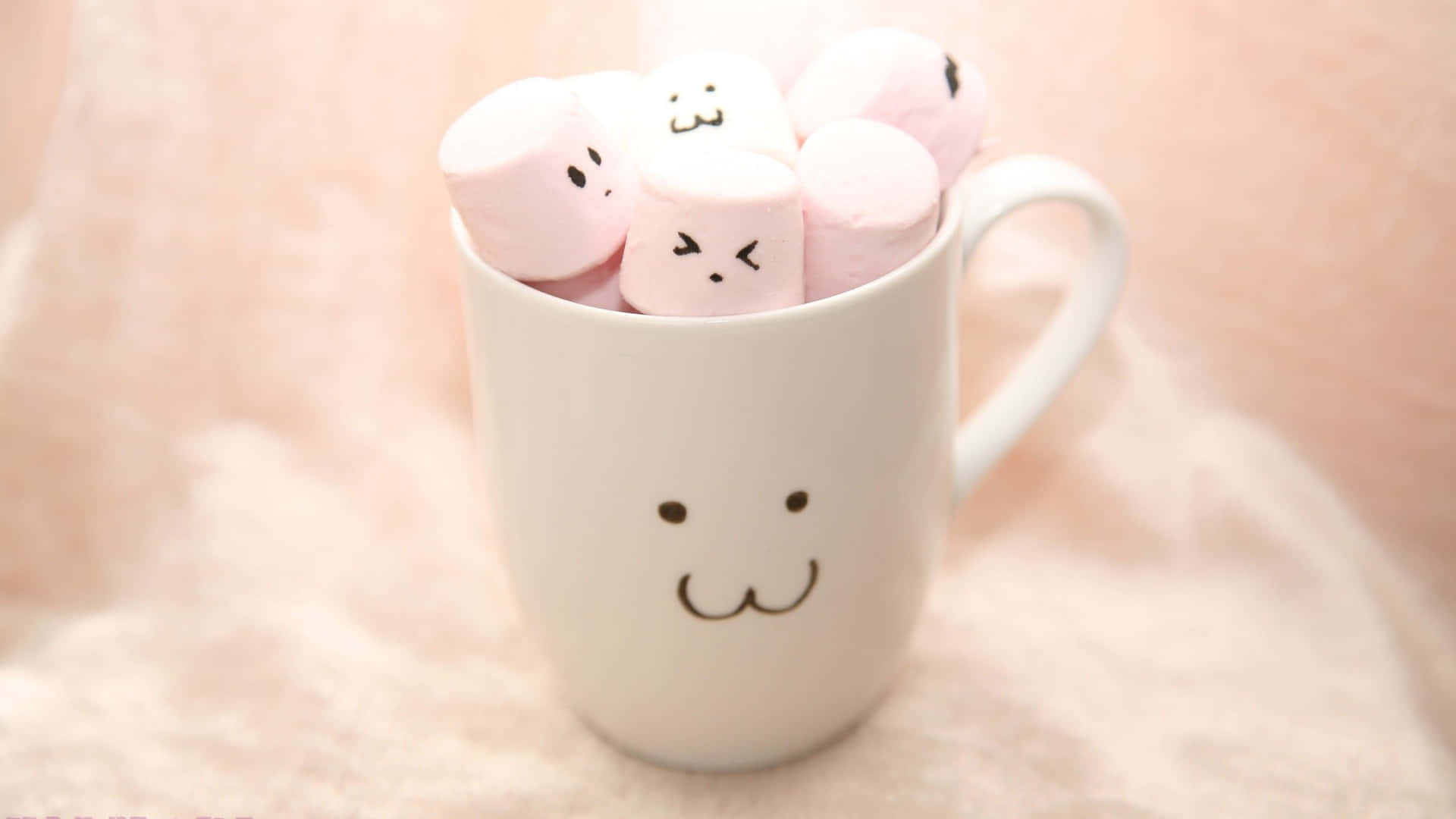 Marshmallows In A Cup With Faces On Them Wallpaper