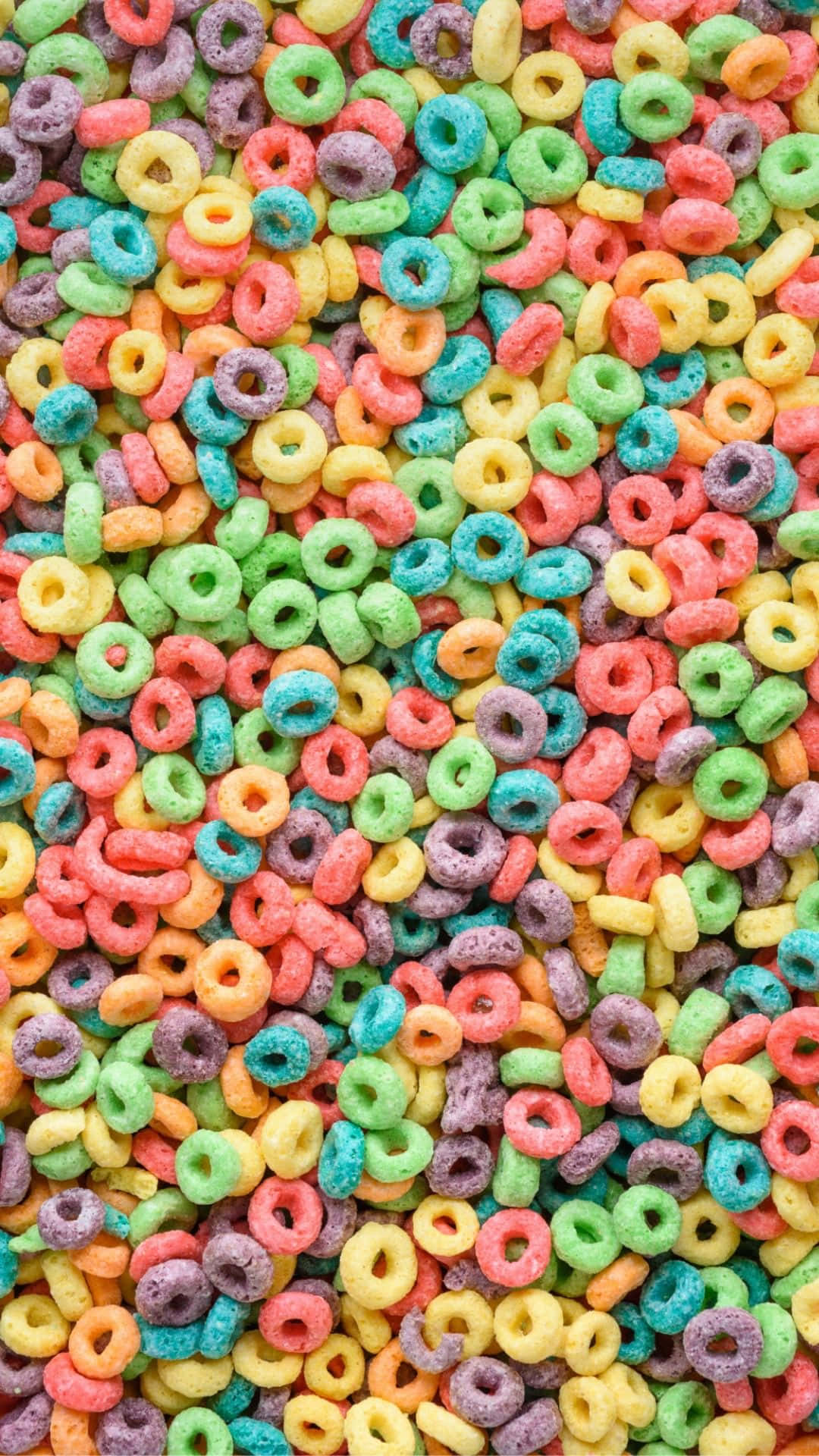 Anillosde Cereal Coloridos En Una Pila. Fondo de pantalla
