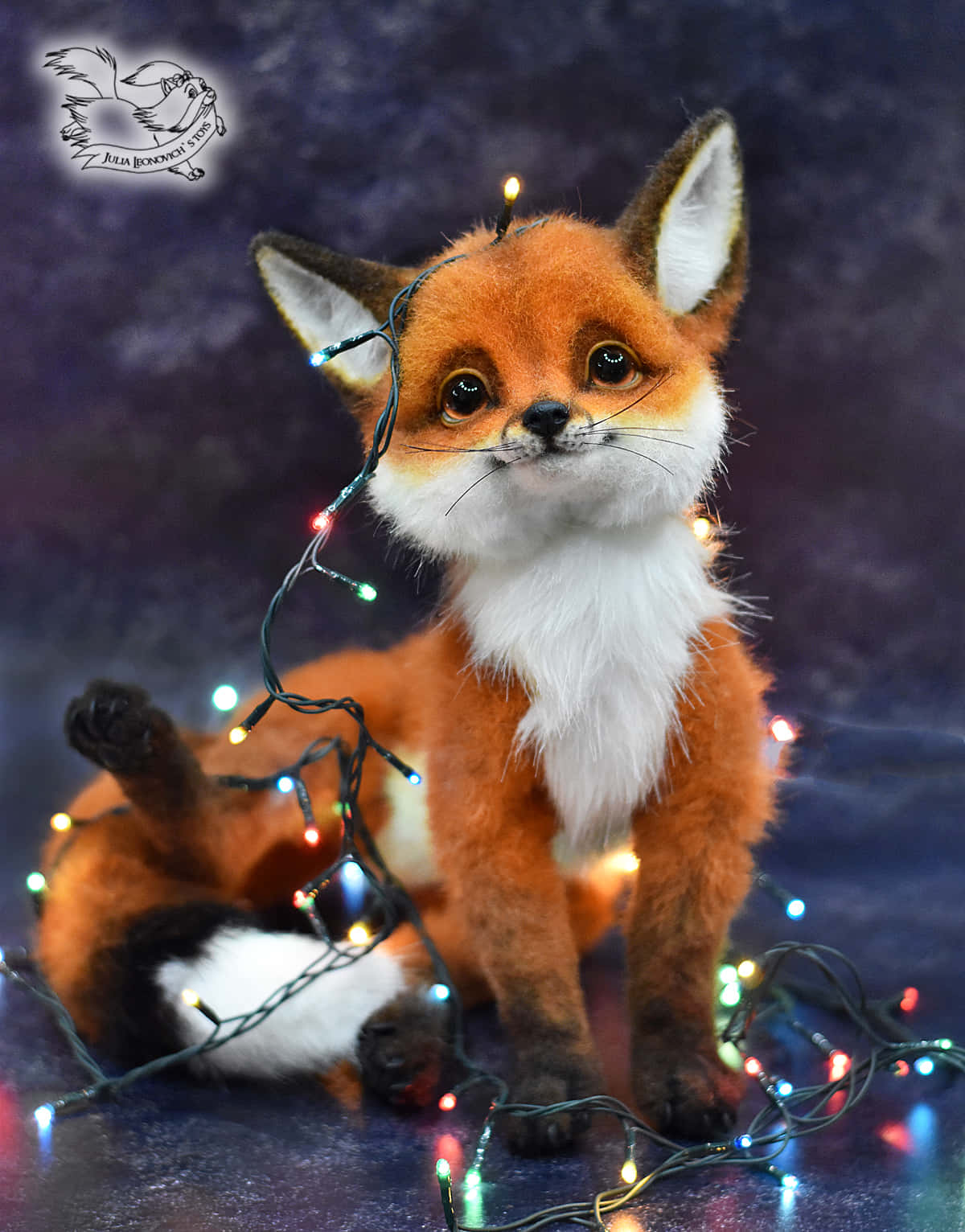 A Stuffed Fox With Christmas Lights Around It