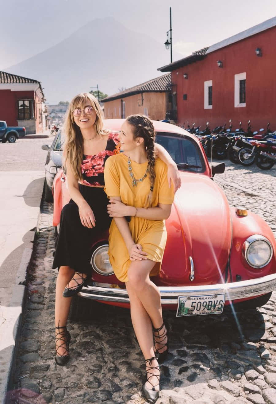 Cute Friend Sitting On Vintage Car Picture