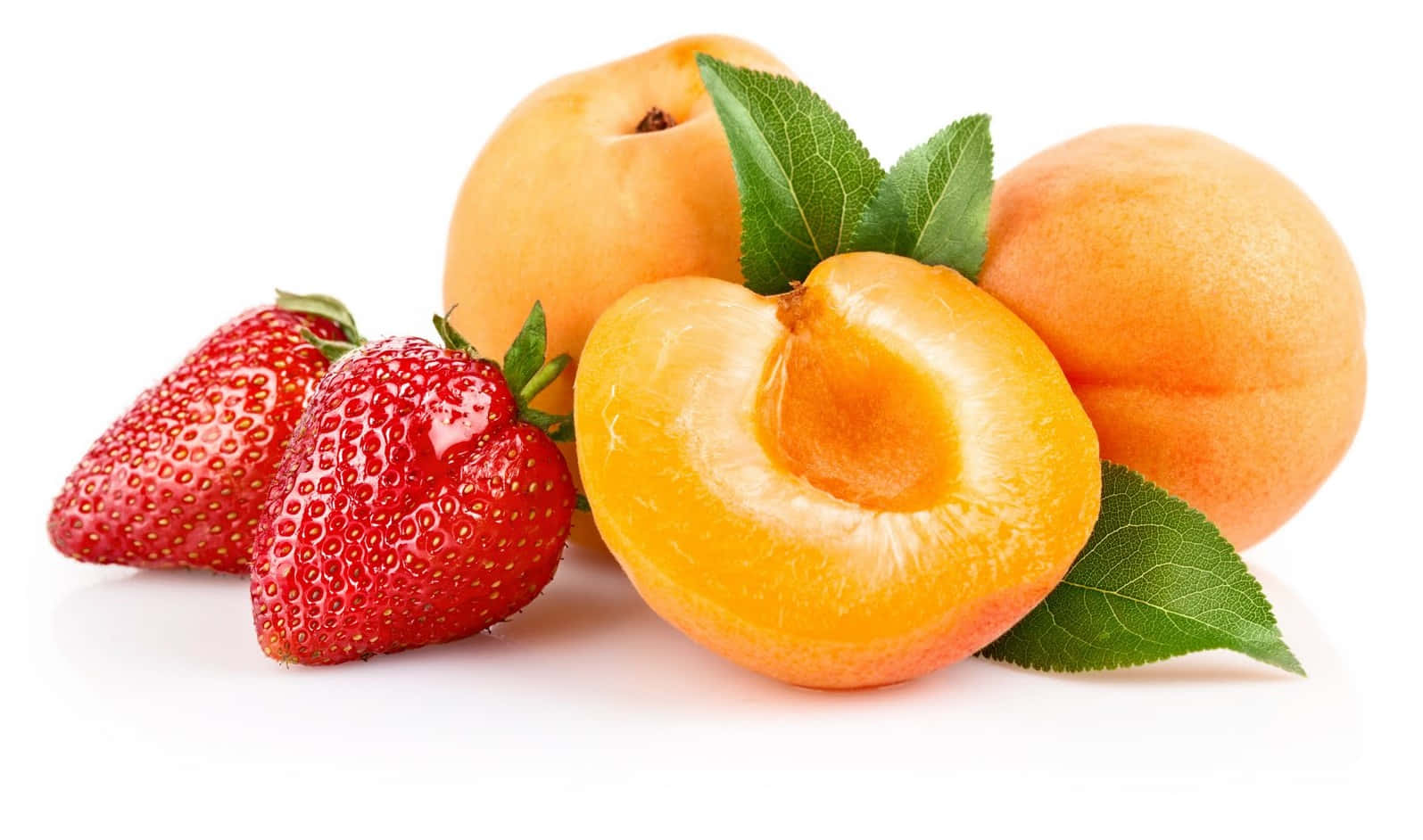 A playful arrangement of delectably fresh peaches and strawberries. Wallpaper