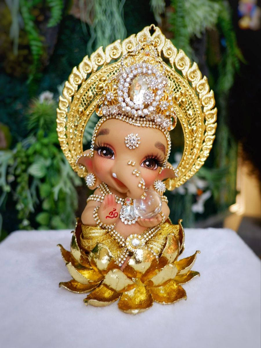 Cute Ganesha On Golden Lotus Wallpaper