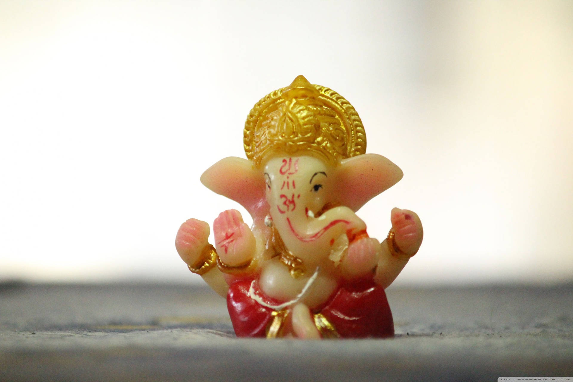 Download Cute Ganesha On Gray Fabric Wallpaper | Wallpapers.com