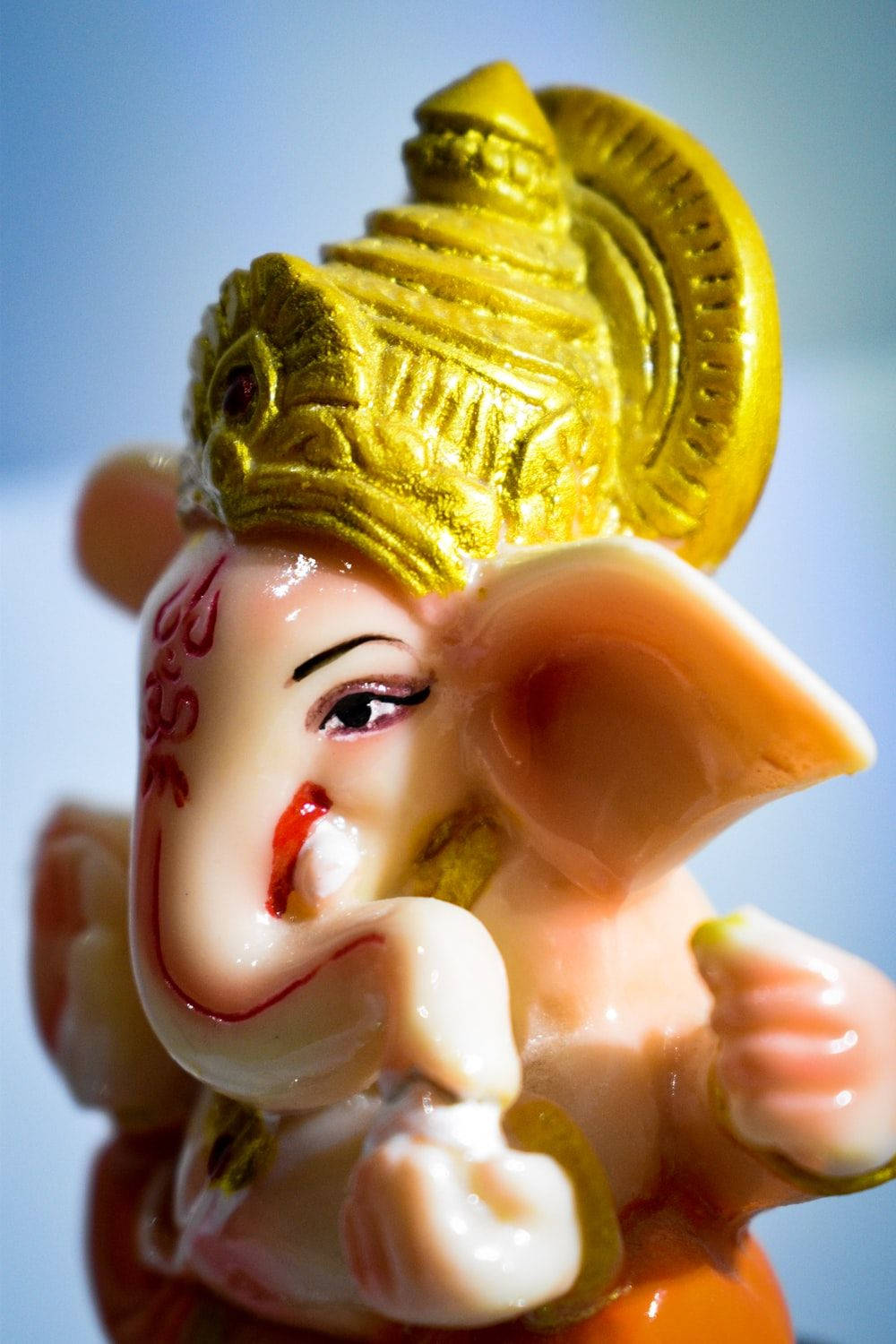 Divine Charm - A Cute Ganesha Figurine Wallpaper