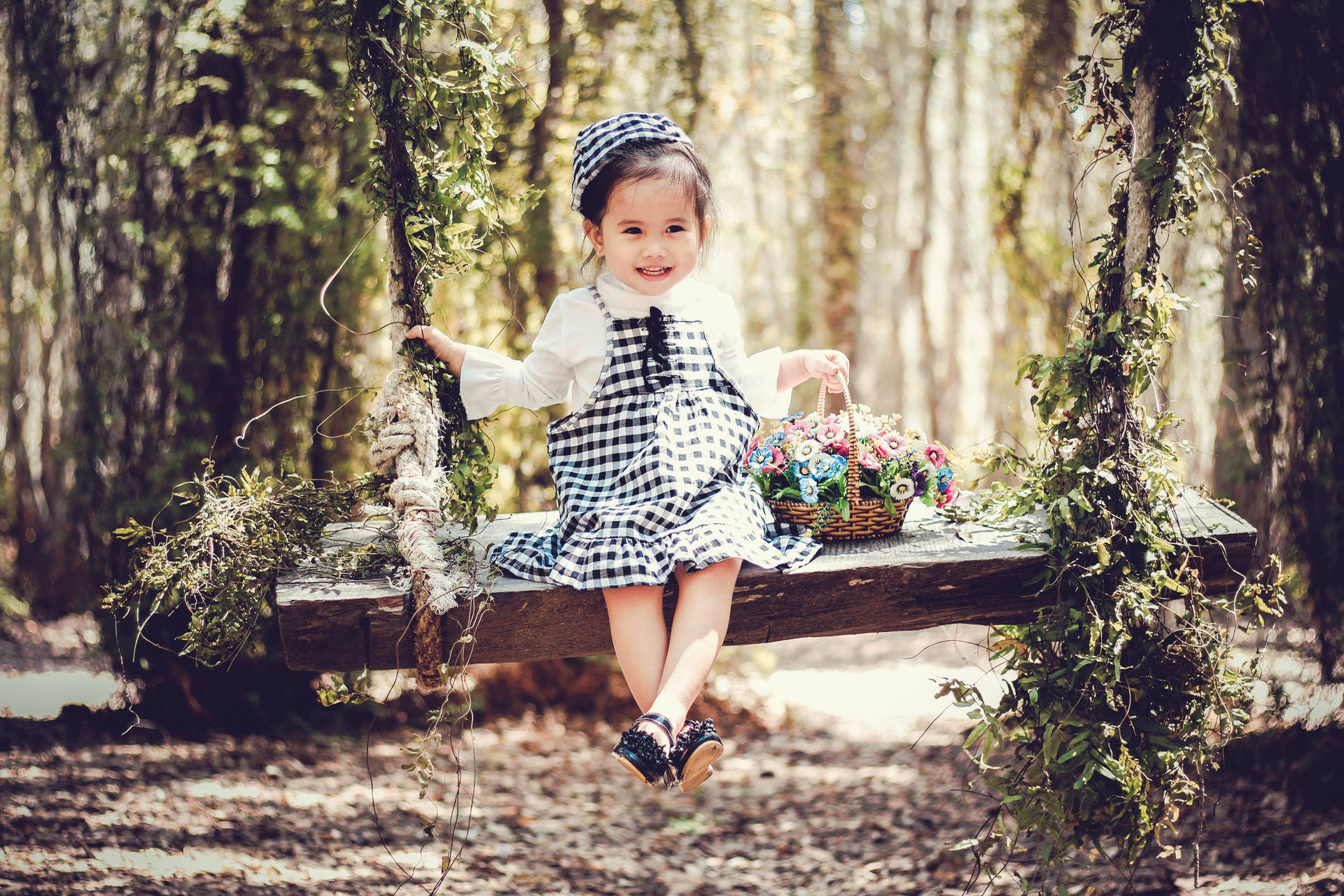 Cute Girl In Forest Wooden Swing Wallpaper