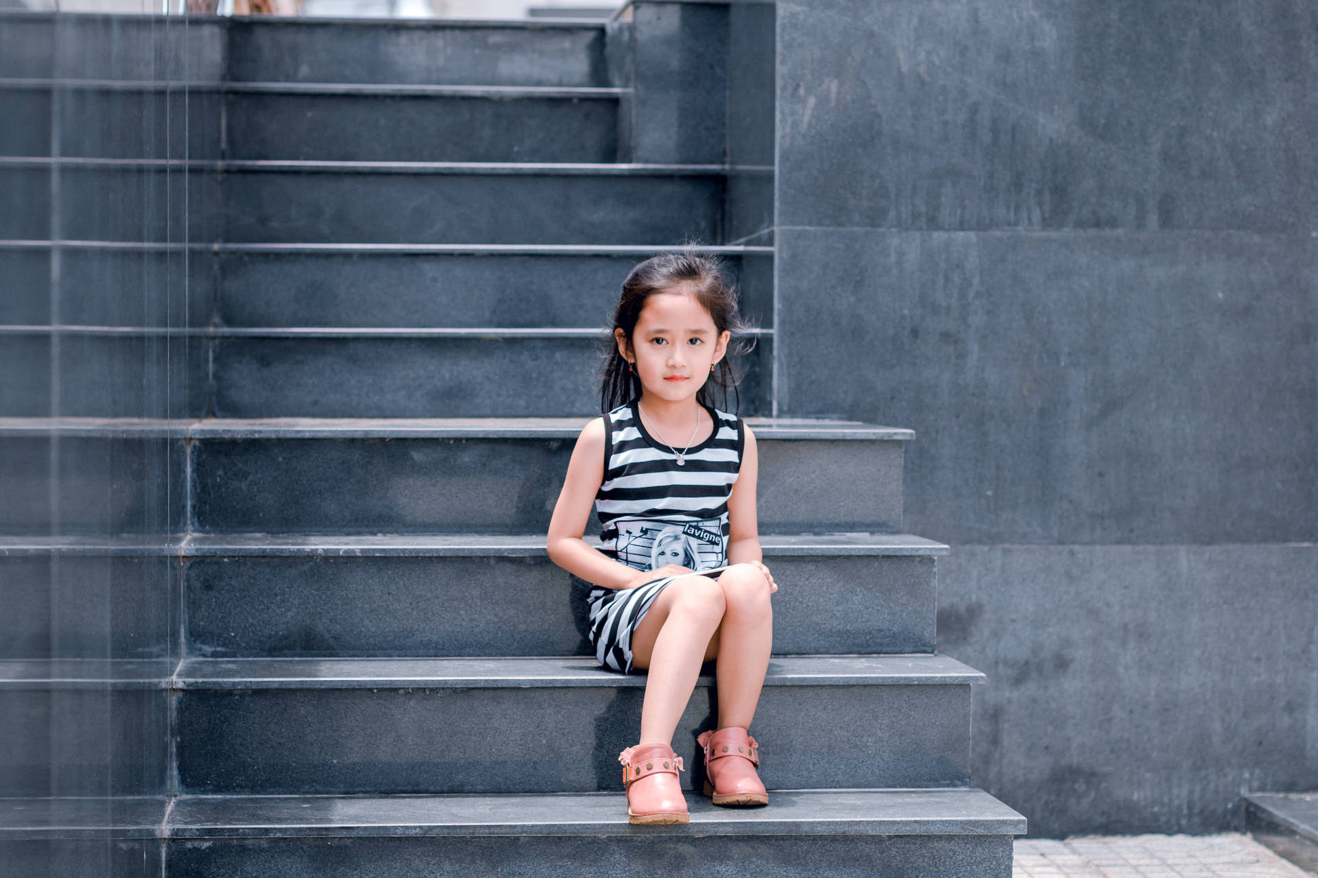 Cute Girl In Gray Stairway Wallpaper