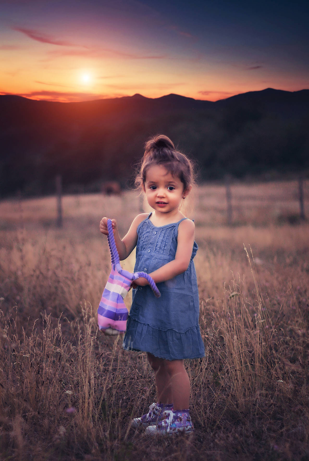 Cute Girl With Bag In Grass Field Wallpaper