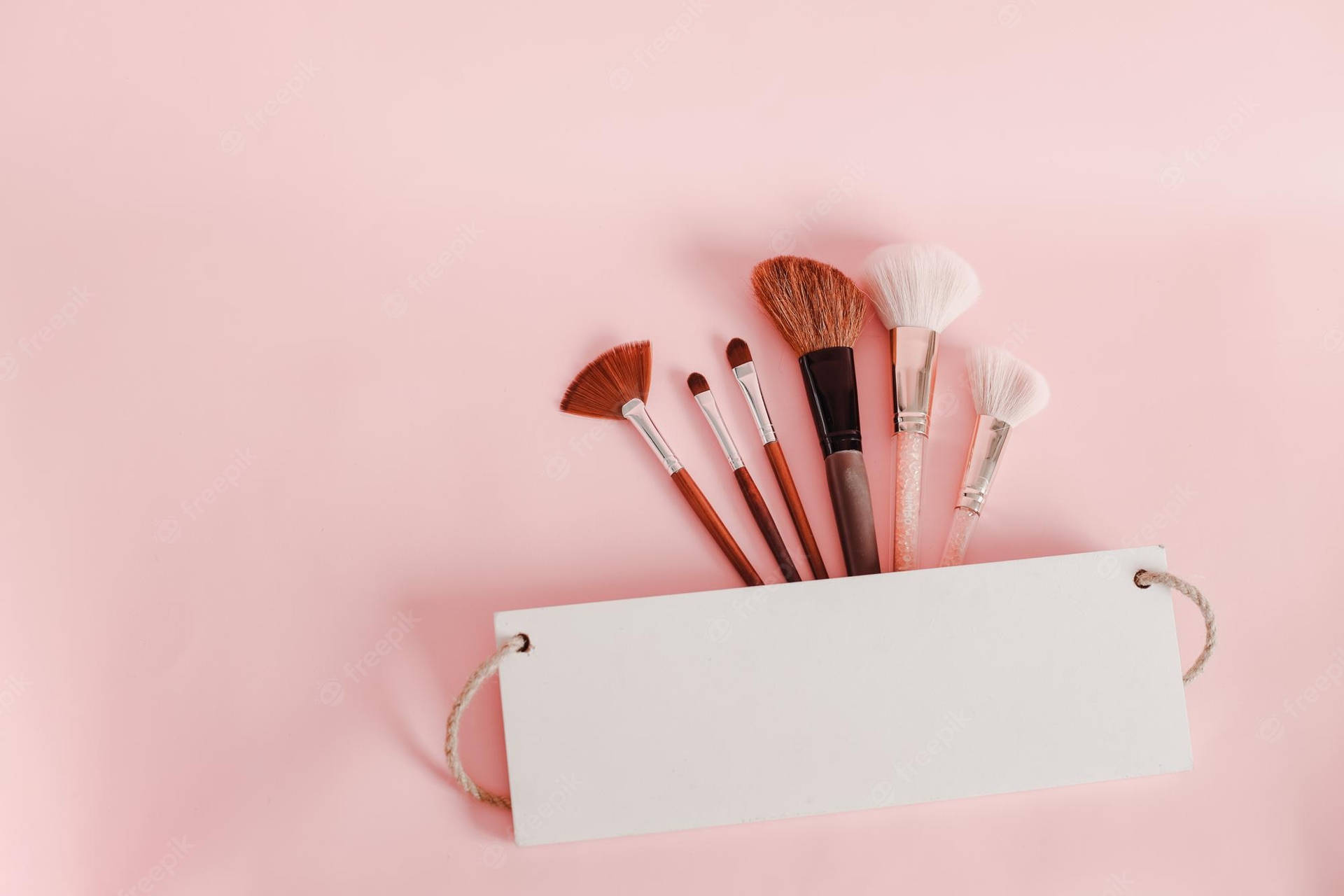 Cute Girly Brushes In Pouch Wallpaper