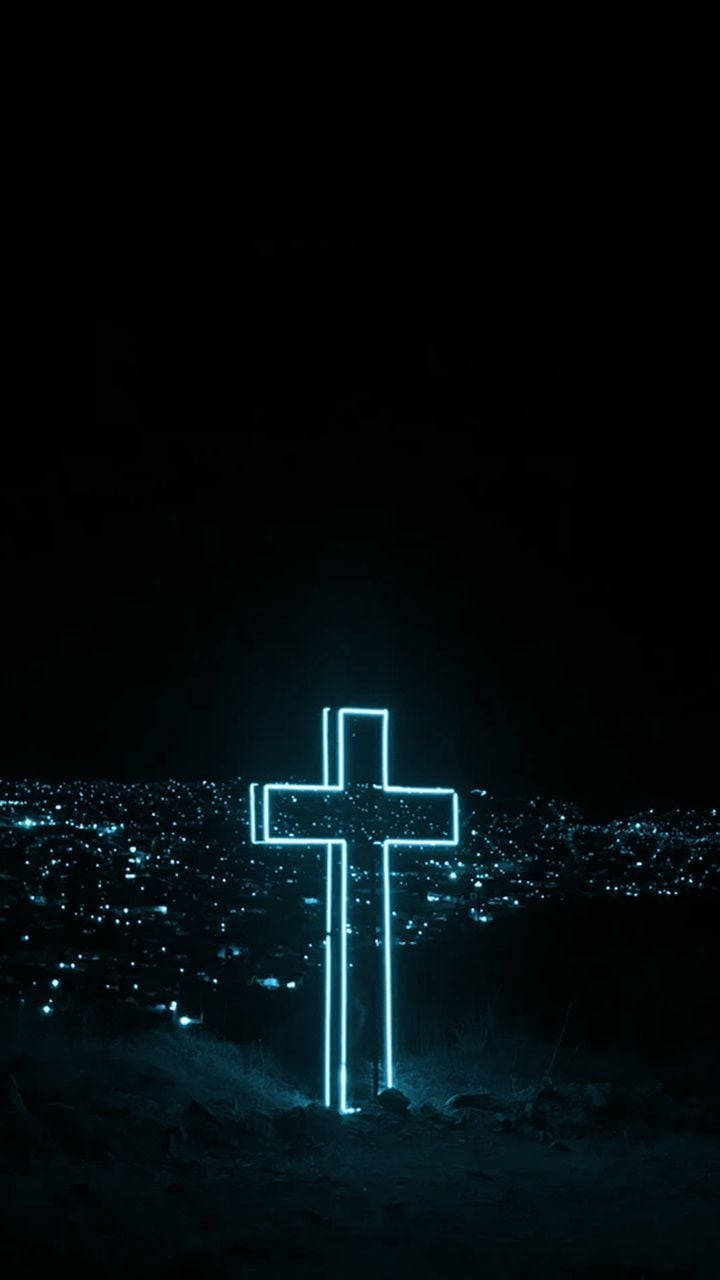 A Cross With Neon Lights In The Dark Wallpaper