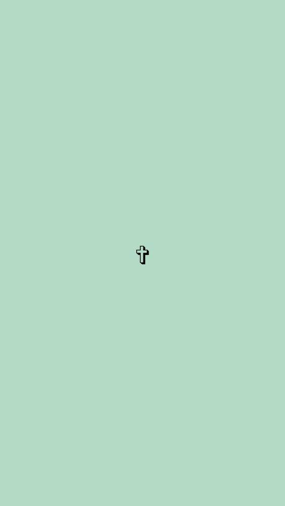 A Small Cross On A Green Background Wallpaper