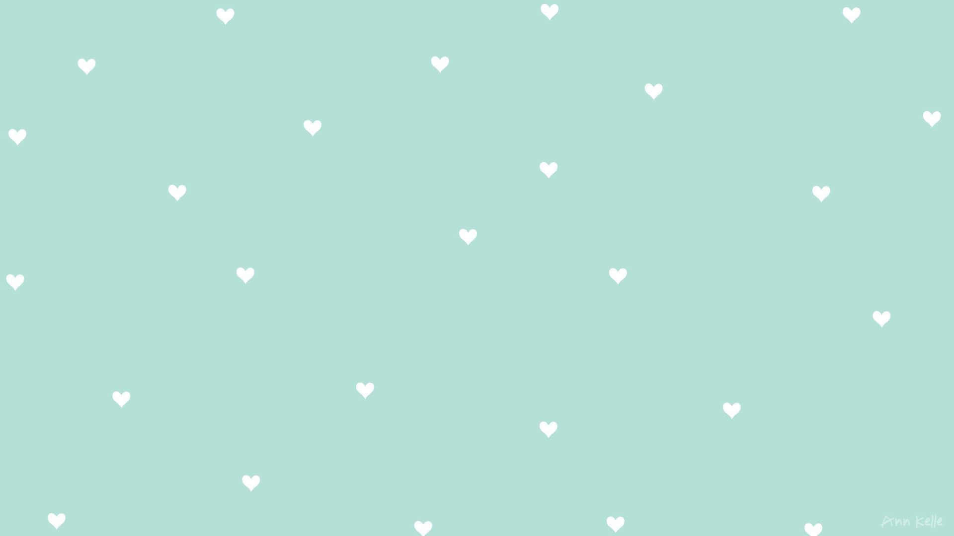 A White Heart Pattern On A Mint Green Background