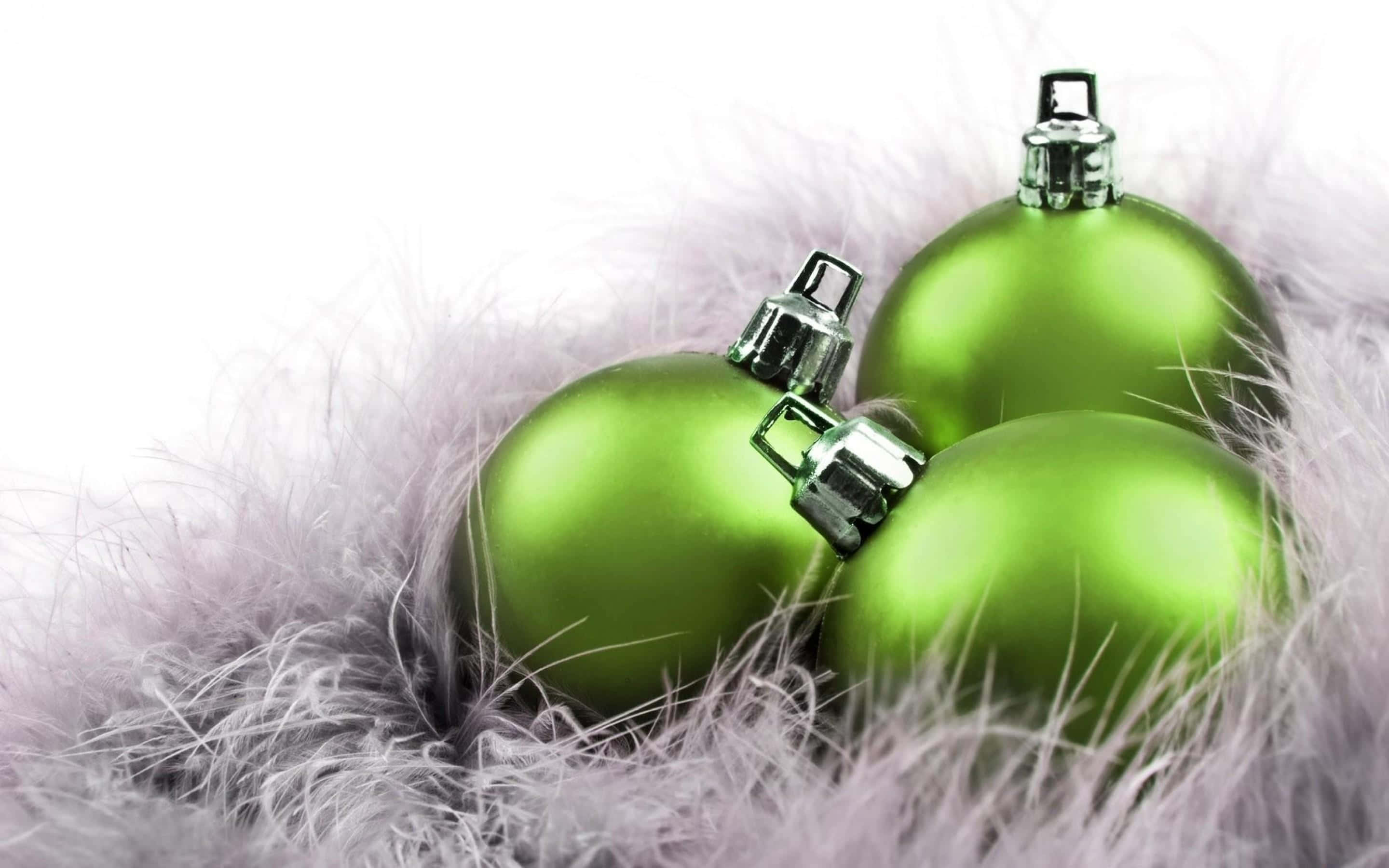 green christmas balls on a white background