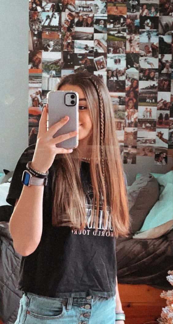 A Girl Taking A Selfie In Her Room