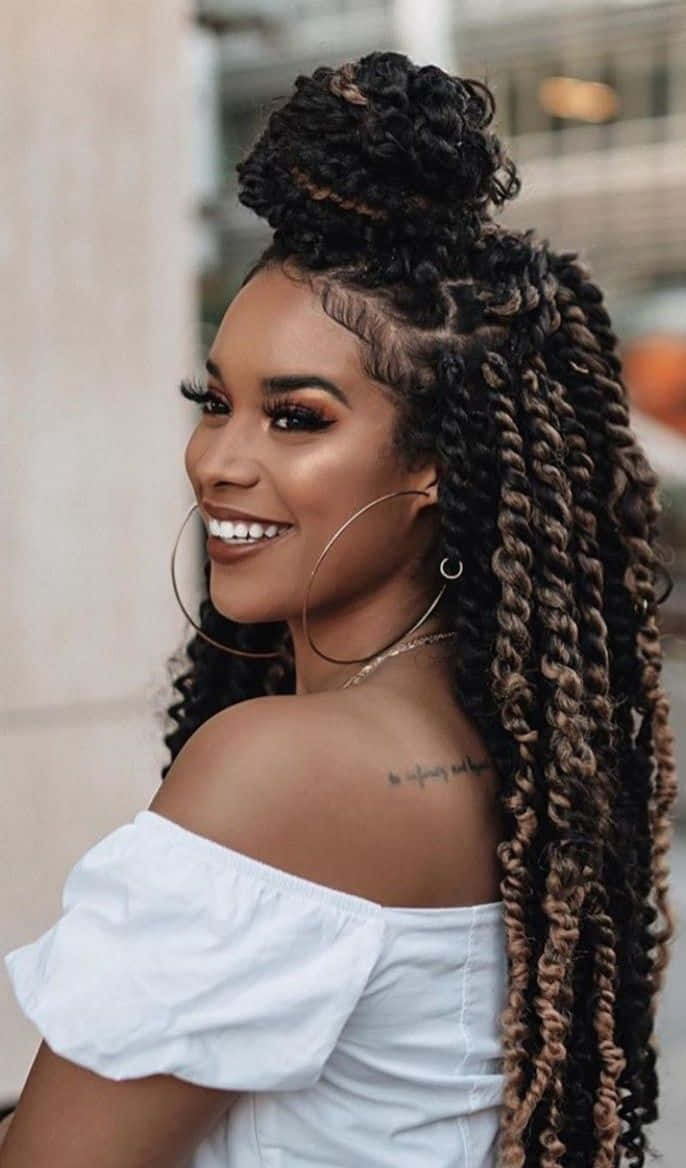 A Woman With Long Braids And A Smile