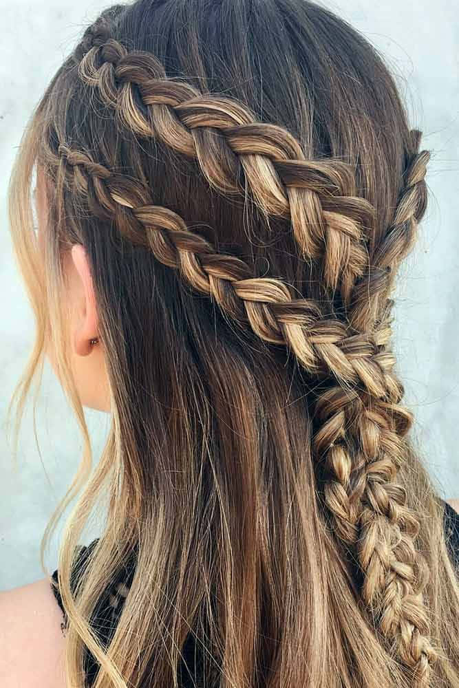 A Woman With Long Hair And Braids In Her Hair