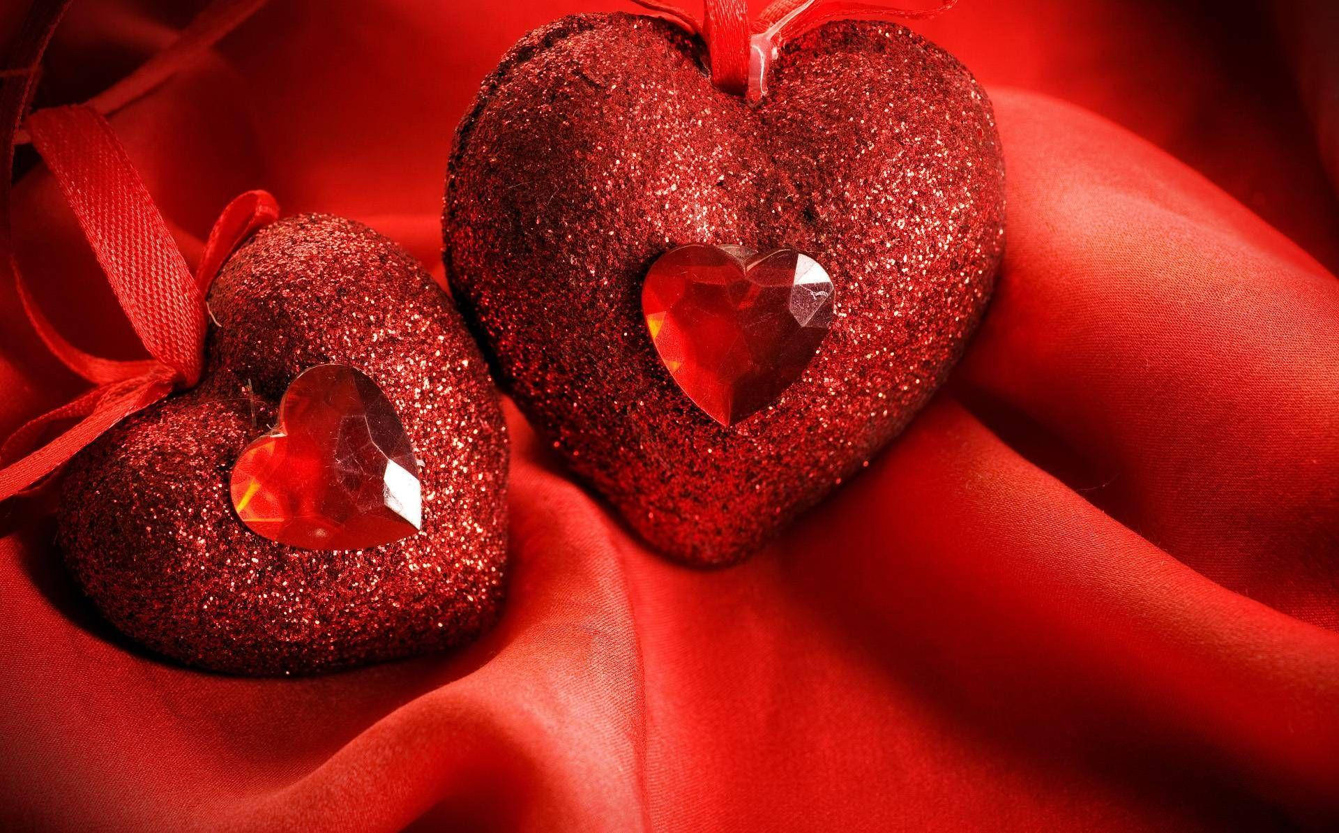 Cute Heart Gems On Red Pillows Wallpaper