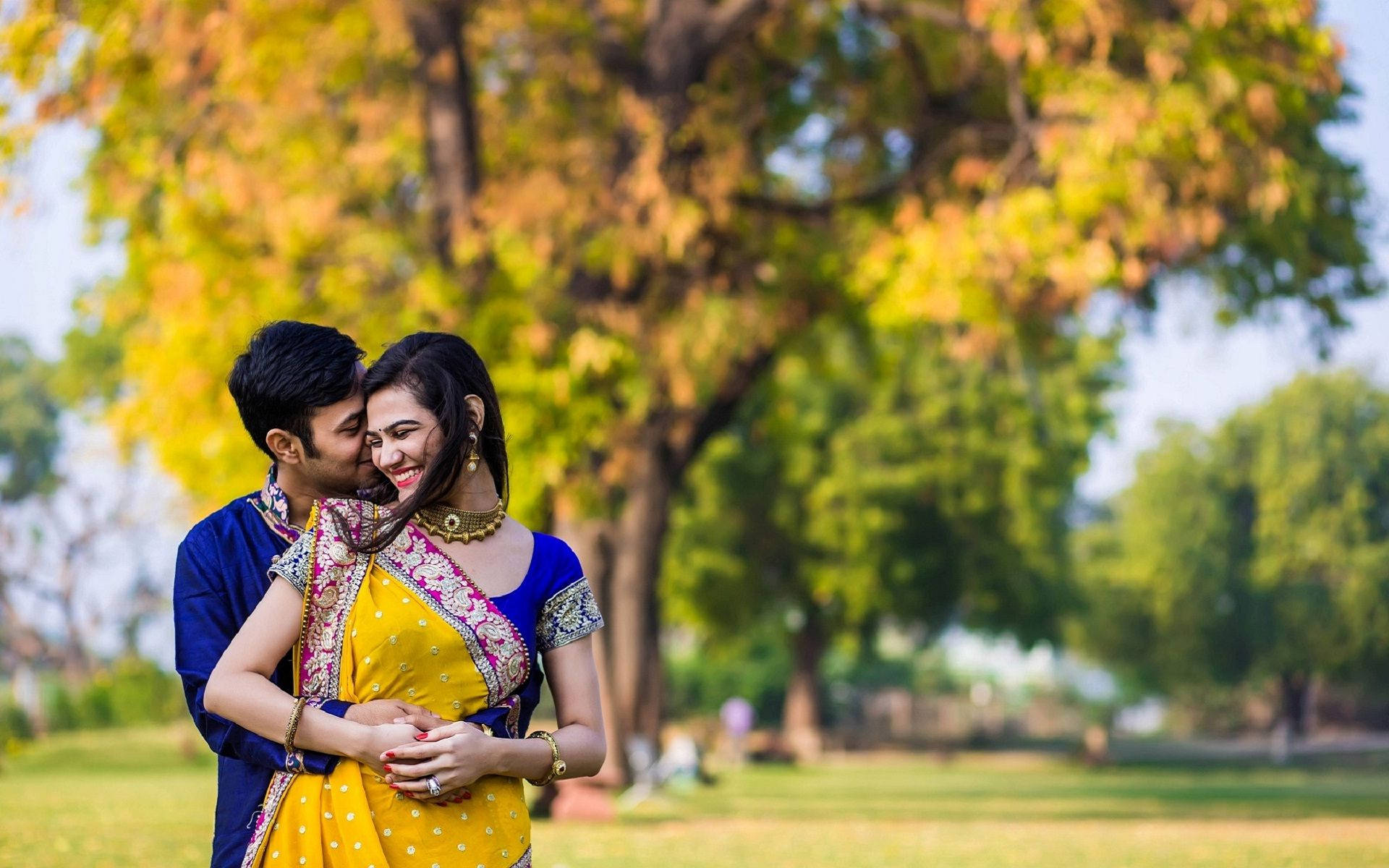 Cute Indian Couple In Wedding Attire At Park