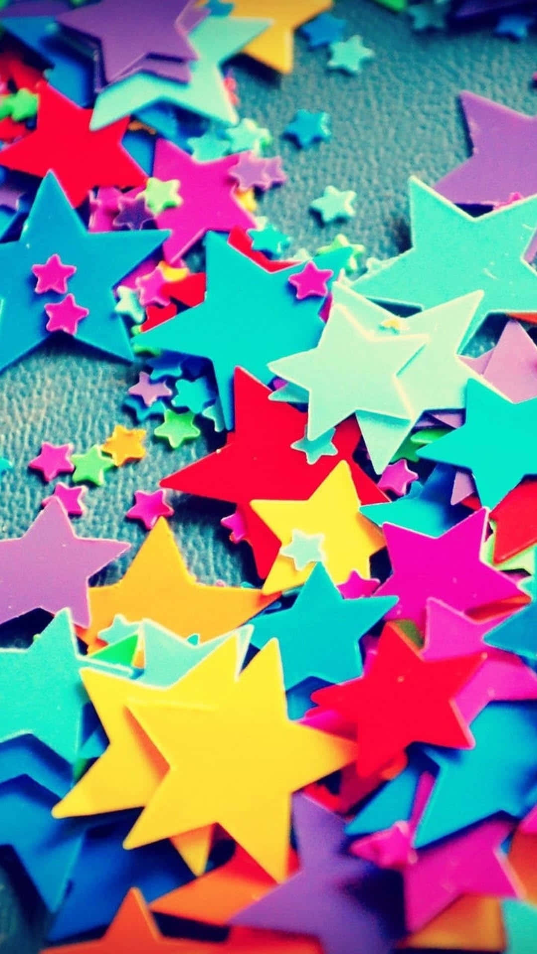 Colorful Stars Are Scattered On A Table Wallpaper
