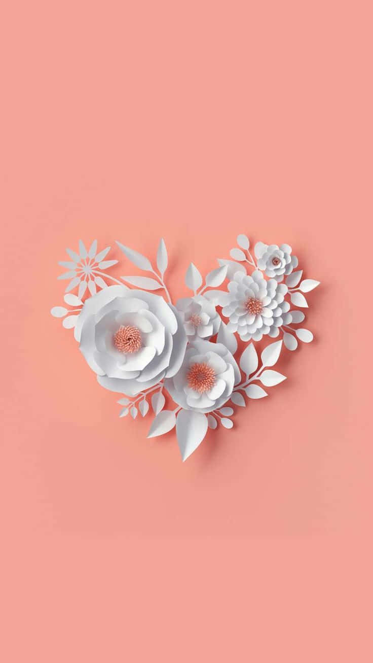 A White Paper Heart With Flowers On A Pink Background Wallpaper