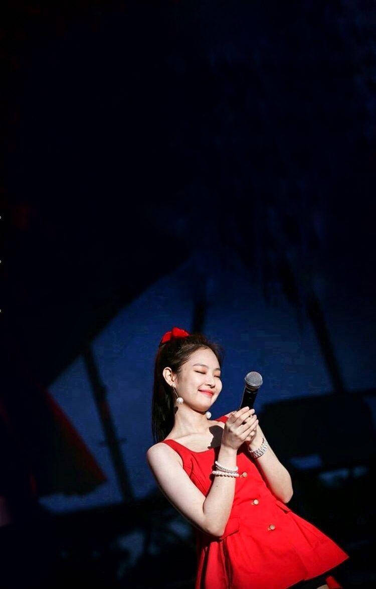 Cute Jennie Smiling In Red Dress Wallpaper
